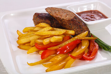 Roasted sausage with fried potato