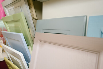 Samples of kitchen facades in a showroom for furniture production