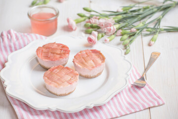 Mini pink rhubarb desserts and flowers