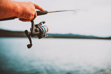 Fishing on the lake at sunset. Fishing background.