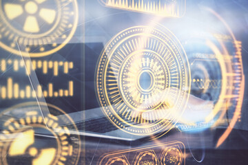 Technology theme hologram with man working on computer on background. High tech concept. Double exposure.