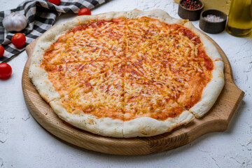 Italian pizza Margherita on white concrete table