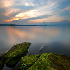 Landscape captured at sunset with textured foreground and long exposure