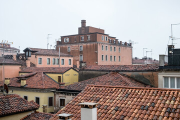Fototapeta na wymiar The red roofs of the old romantic Venice, Italy