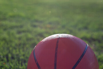 close-up of a biketball ball on a background of grass. Outdoors