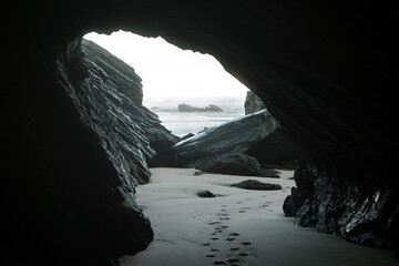 Morning view from the cave on the ocean and rock.