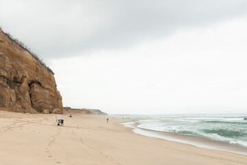 Beautiful sandy beach in a cloudy day.