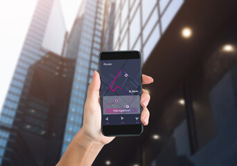Female Hand Holding Smartphone Using Offline Map In City, Closeup