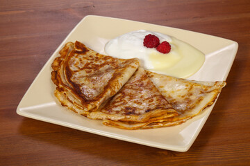 Pancakes with sour cream and condenced milk