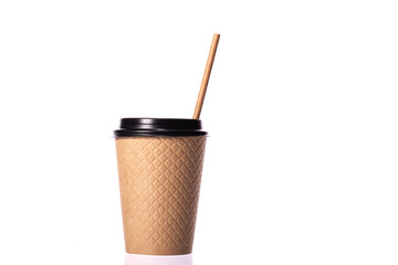 Modern disposable brown waffle kraft cup with paper straw isolated on white background. Coffee to go, takeaway hot drinks, cafe, Recycling, eco-friendly tableware concept, mockup template. Copy space