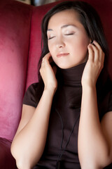 woman listening music in headphones