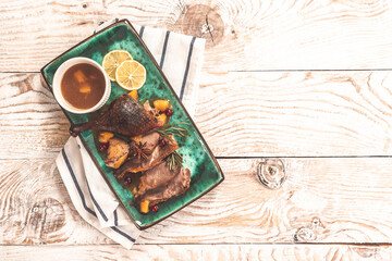 Crusty goose with leg citrus fruit and prune sauce. Cooking at Christmas time, banner, catering menu recipe place for text, top view