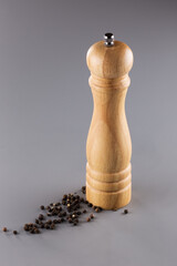 an elegant and very necessary wooden pepper mill in the kitchen