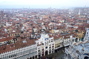 Panorama with the red roofs, Adriatic sea and the most impressive historical buildings of the old romantic Venice, Italy