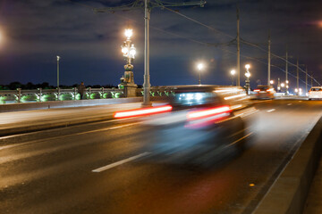 traffic at night in the city, city lights, stop signs 