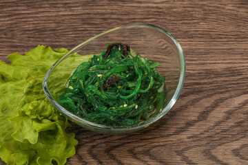 Green Chuka Seaweed Salad Isolated on White Background Top View. Wakame Sea Kelp Salat