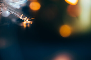 Selective focus image of Christmas lights close-up.