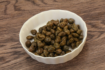 Tasty capers in the bowl