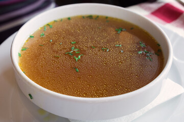 Rich beef bouillon with homemade pasta, vegetables and herbs