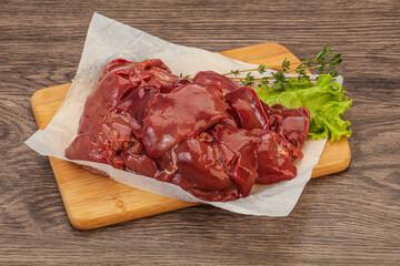 Raw chicken liver over board