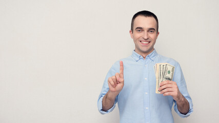 Man with the cash has a good idea, a white background,copy space, 16:9