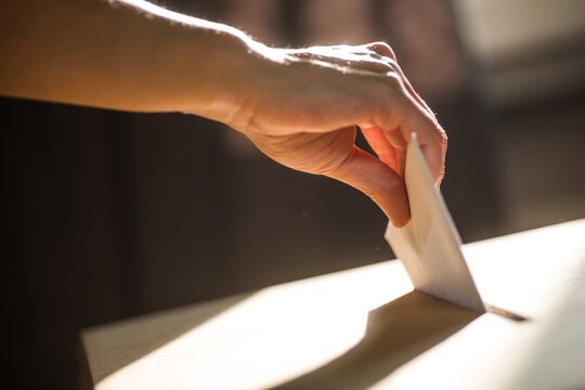 Conceptual image of a person voting during elections