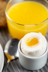 Hotel breakfast with boiled egg and orange juice