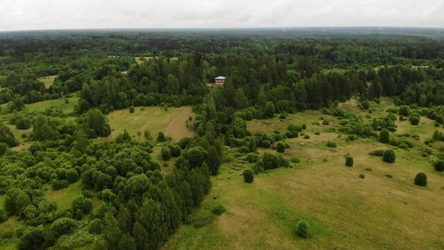two-storey wooden house hill green forest. village Russian general Suvorov.