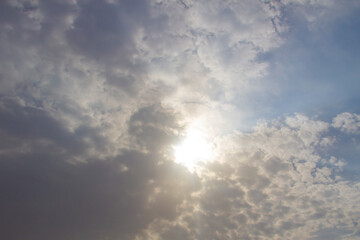Grey clouds with sunlight against background