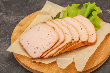 Boiled pork sausage over board