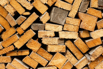 Wall of firewood. Preparation of firewood for the winter. Background of dry chopped firewood logs in a pile.