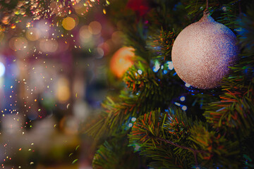 Obraz na płótnie Canvas Christmas tree decorated with beautiful balls and blurred background, Christmas tree background.
