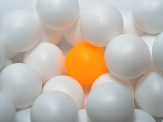 Orange and white table tennis balls Mixed colors, full background