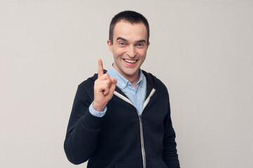 Man raises fore finger as gets remembers to do something, remember error, white background, copy...