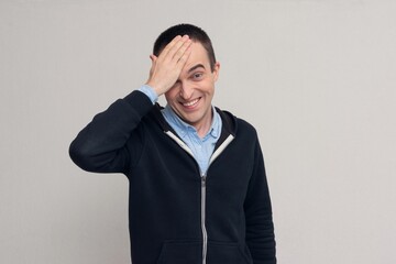 Man with hand on head for mistake, remember error.  white background, copy space