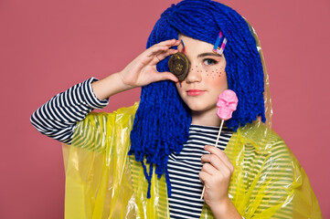 Girl in the suit and the image of a terrible doll with a sewn eye. Doll with a button for an eye....