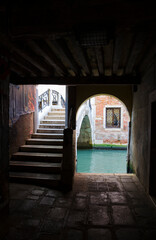 Obraz premium View from the dark tunnel to the bridge over the canal