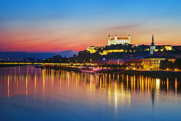 Fototapeta premium Bratislava castle over Danube river and Bratislava old town, Slovakia