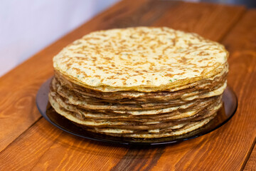 Zucchini pancakes on a wooden table.