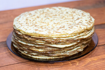 Zucchini pancakes on a wooden table.