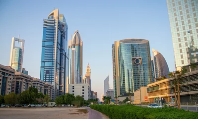 Rolgordijnen Dubai Financial Center road. Landmarks such Jumeirah Emirates towers, Ritz Carlton, Park towers, DIFC on the picture. © Four_Lakes