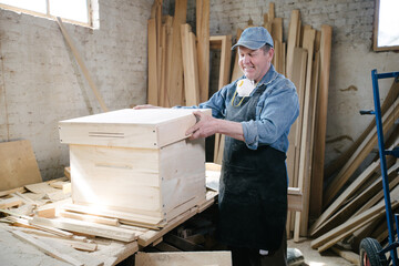 Carpenter man posing in carpentry workshop