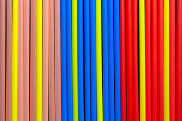 Obraz premium close-up on multi coloured plastic drinking straws in a row