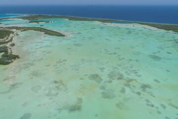 Top view Caribbean Island with mangrove and various shades of blue. Bay from drone look like heaven, Los Roques, National Park