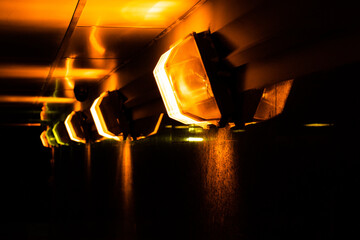 Lights in the dark tunnel. Illumination of modern underground life 