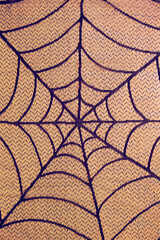 Orange cobweb texture with black lines.