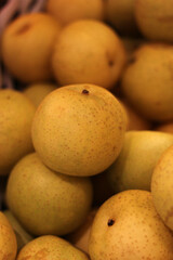 Close up of a group of ripe pears, soft focus