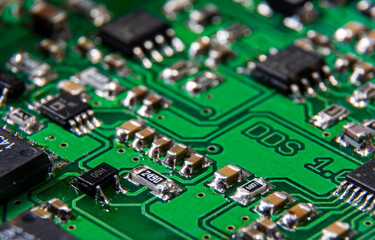 Obraz premium Close-up to printed circuit board with electronic components.