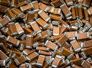 Close-up of lots of surface mount electronics components - capacitors