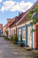 Idylic cobbled street at the old town of Aalborg, Denmark